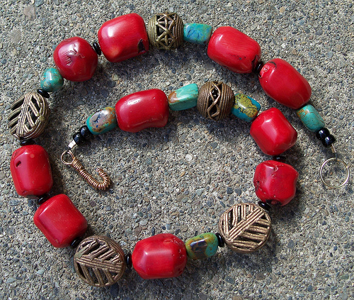 African-inspired necklace  by Judy Merrill-Smith featuring hand-cut coral beads similar to Ivie.